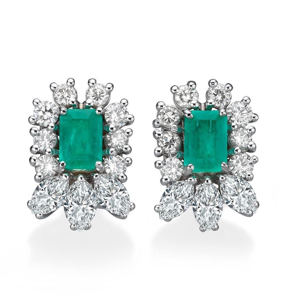 Gold earrings set with emeralds and diamonds